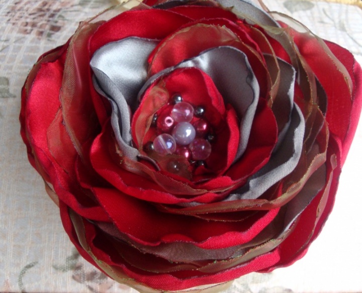 Brooch-flower with red petals of gray