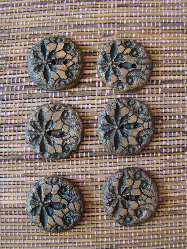 Aged clay buttons