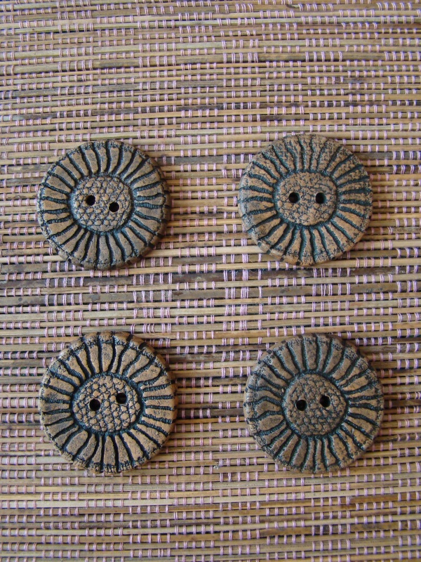 Aged clay buttons