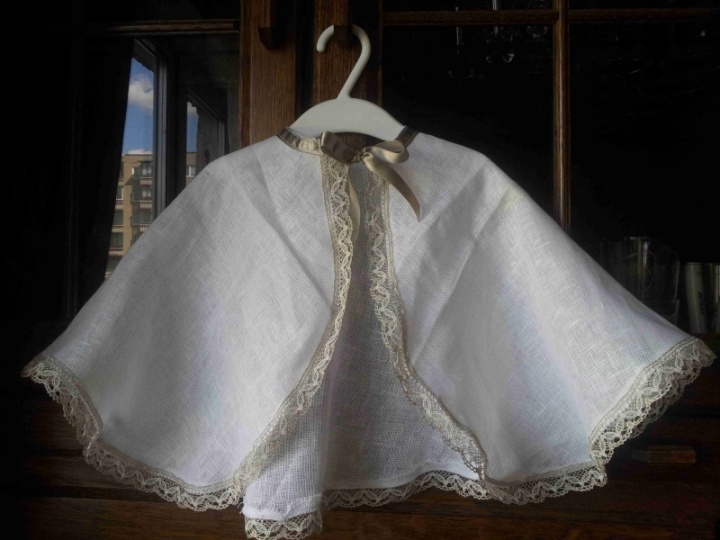 Baptizes coat with decorations and candles