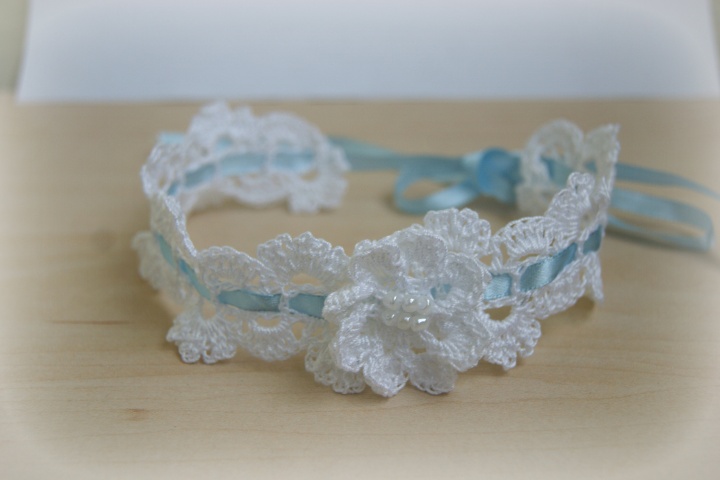 Christenings or other occasion and white headband with a flower