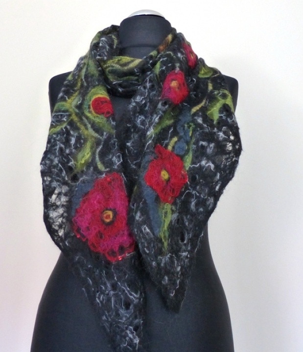 Black openwork felting processes country with poppy seeds.