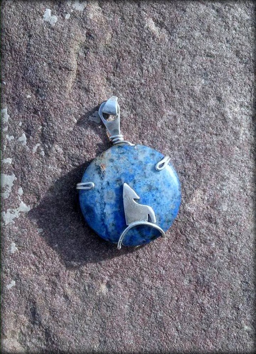 Pendant with silver wolf