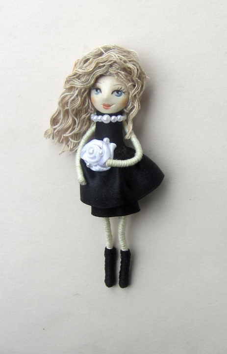 Doll brooch