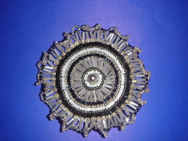 Grey brooch