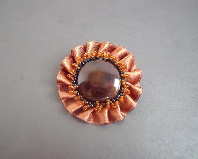 Brown brooch